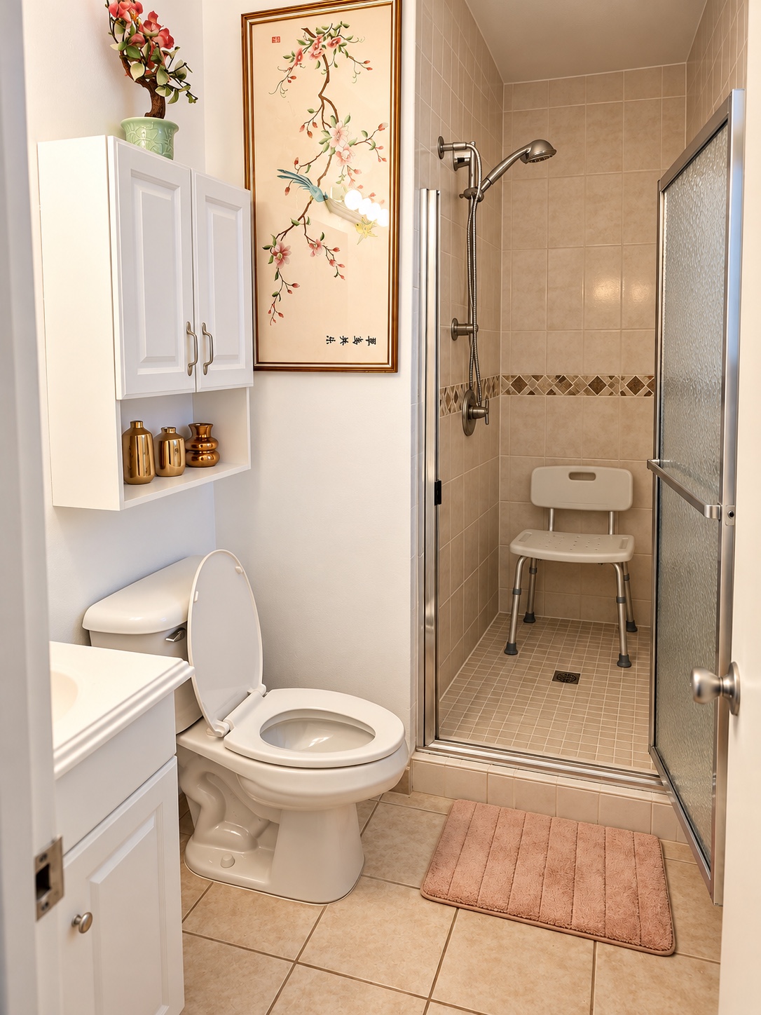 Bathroom and shower with handheld showerhead and shower chair
